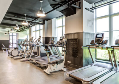 363 Bond Street, Brooklyn luxury apartments spacious indoor fitness center with various workout equipment facing huge windows