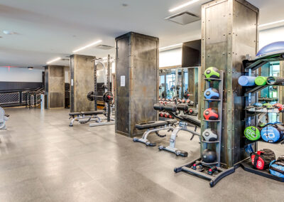 Spacious indoor fitness center at 363 Bond with various workout equipment