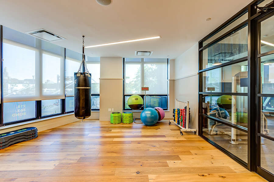 363 Bond Street gym with equipment, heavy punching bag, and scenic views