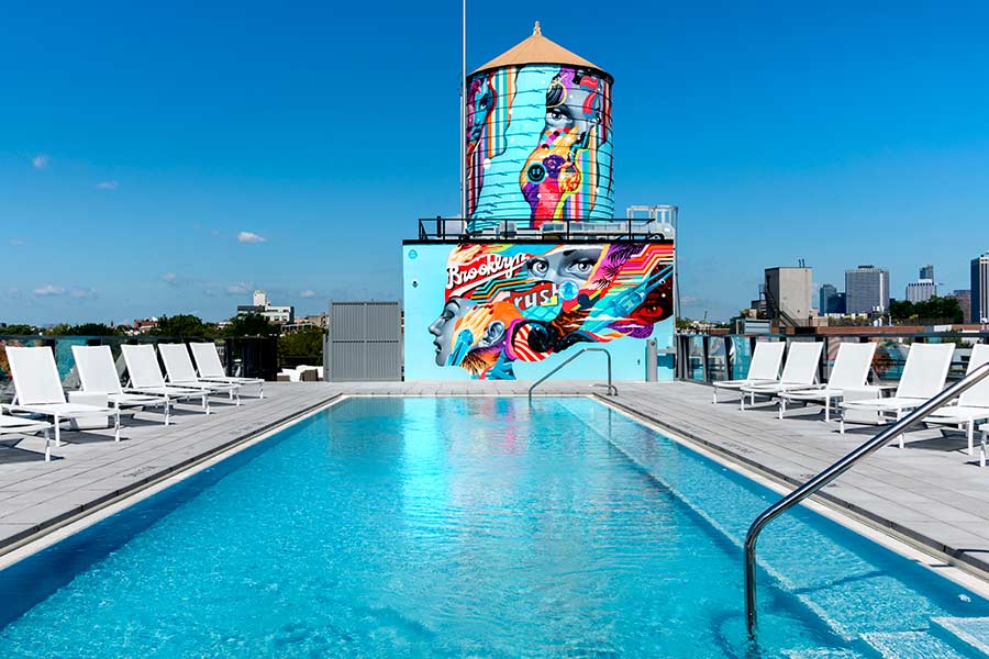 Brooklyn Crush pool and water tower with mural by Tristan Eaton